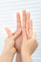 Physiotherapist Massaging Palm