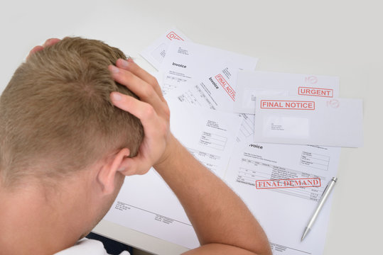 Frustrated Man With Unpaid Bills