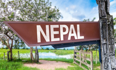 Obraz premium Nepal wooden sign with rural background