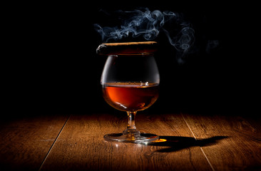 Cigar on wineglass