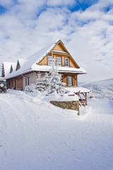 Mountain cottage in winter in the Beskids Mountains, Poland