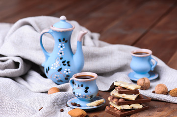 Cookies and chocolate with cup of coffee