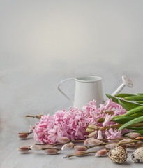 Easter still life with a bunch of willow, hyacinths and quail eg