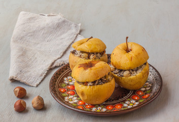 Baked apples with raisin, poppy seeds, rice and honey