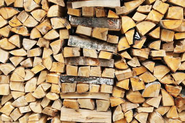 firewood stacked for storage, background