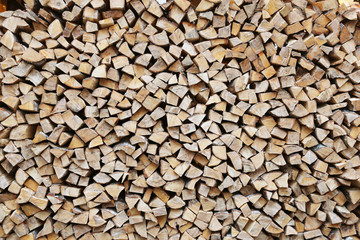 firewood stacked for storage, background