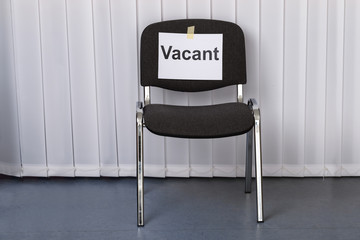 Office Chair With A Vacant Sign