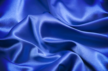 Blue satin fabric close up