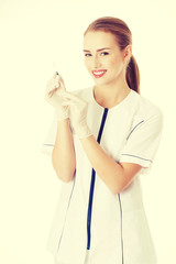 Beautiful young nurse or doctor with needle.