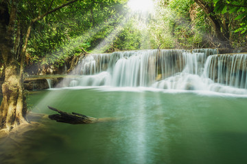 Waterfalls with shining sun rays