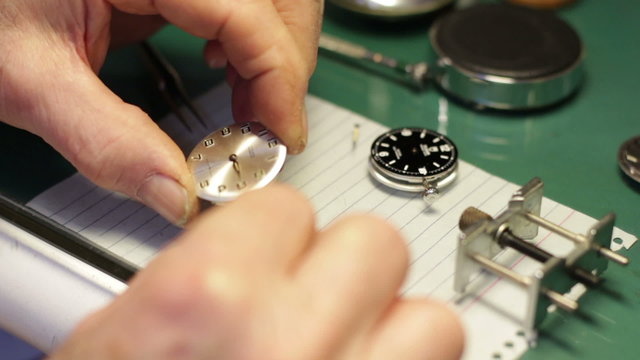watchmaker assembles a watch