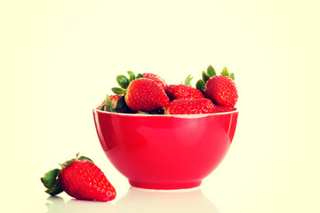 Fresh red strawberries in a bowl.
