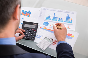 Businessman Calculating Finance