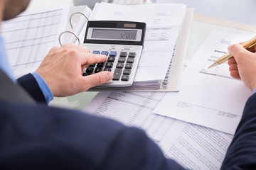 Businessman Doing Calculating