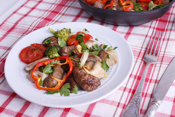 Braised wild mushrooms with vegetables and spices in pan and