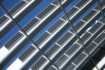 Solar Panels Against The Deep Blue Sky