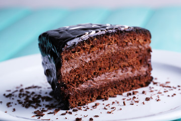 Delicious chocolate cake on plate on table close-up