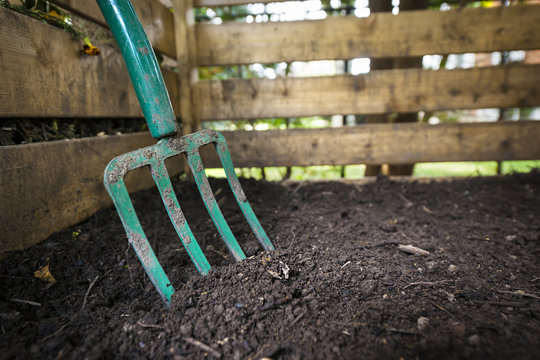 Garden fork turning compost