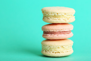 Gentle colorful macaroons on color background