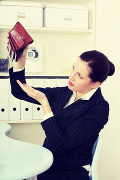 Beautiful business woman with empty wallet.