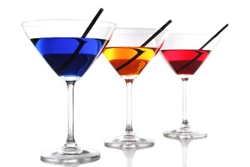 Colorful alcoholic beverages in glasses isolated on white