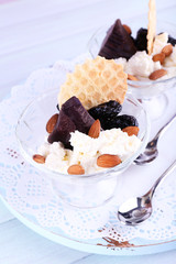 Dessert with prunes in glass bowls