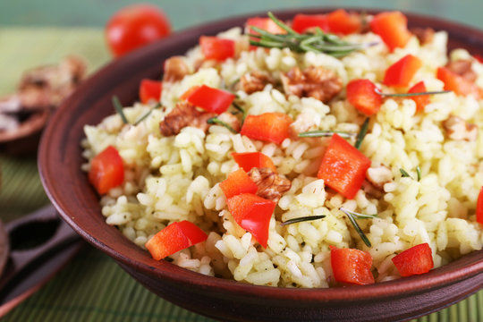 Rice with walnuts and cherry tomatoes in plate