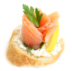 Canape with salmon and herbs isolated on white
