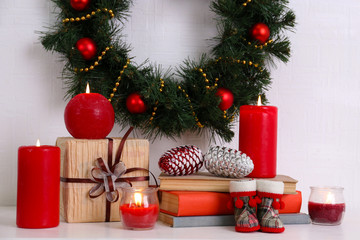 Christmas decoration with wreath, candles and present boxes