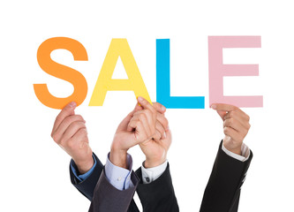 Hands Holding Letters Building The Word Sale