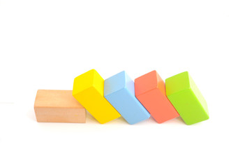 Wooden building block on white background.