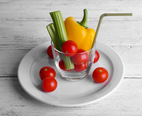 Vegetables in glass with tube