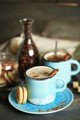 Beautiful composition with tasty cappuccino on wooden table