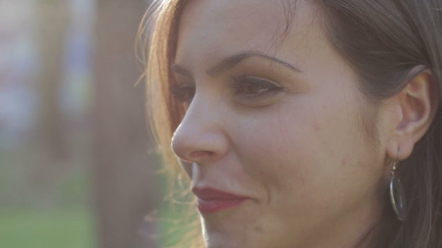 profile of beautiful woman that is smiling - wellness - happiness - laugh