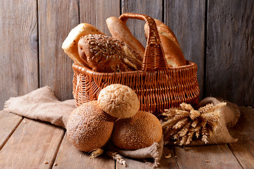 Obraz na płótnie Canvas Different bread on table on wooden background