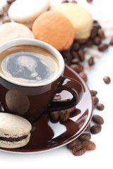 Gentle colorful macaroons and black coffee in mug isolated