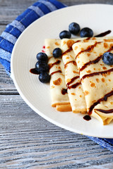 Sweet crepes with chocolate sauce