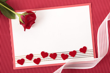 Valentine card with ribbon and rose