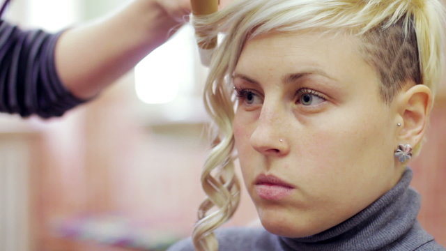 a woman gets her hair done  - hairdresser - hairstylist