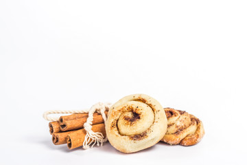 isolated buns with cinnamon sticks