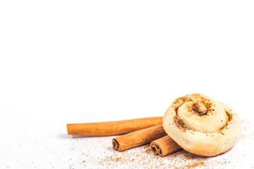 isolated bun with cinnamon stick