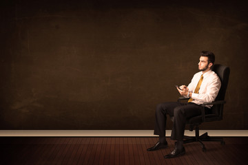 Businessman holding high tech tablet on background with copyspac