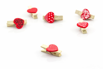 Wooden clothespin heart shaped.