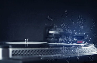 Turntable playing music with hand drawn cross lines