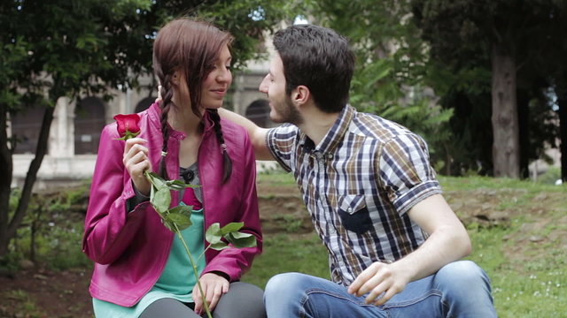 first kiss - early history of love - rose - a man and woman in love - couple