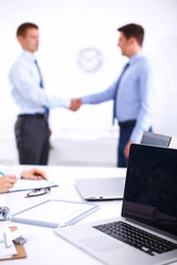 Fototapeta premium Business people shaking hands, finishing up a meeting