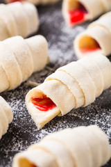 Making croissants with raspberries