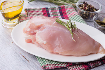 Fresh chicken on wooden table