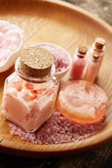Spa still life with soap, sea salt and flower petals