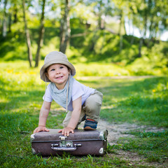 small child on a suitcase
